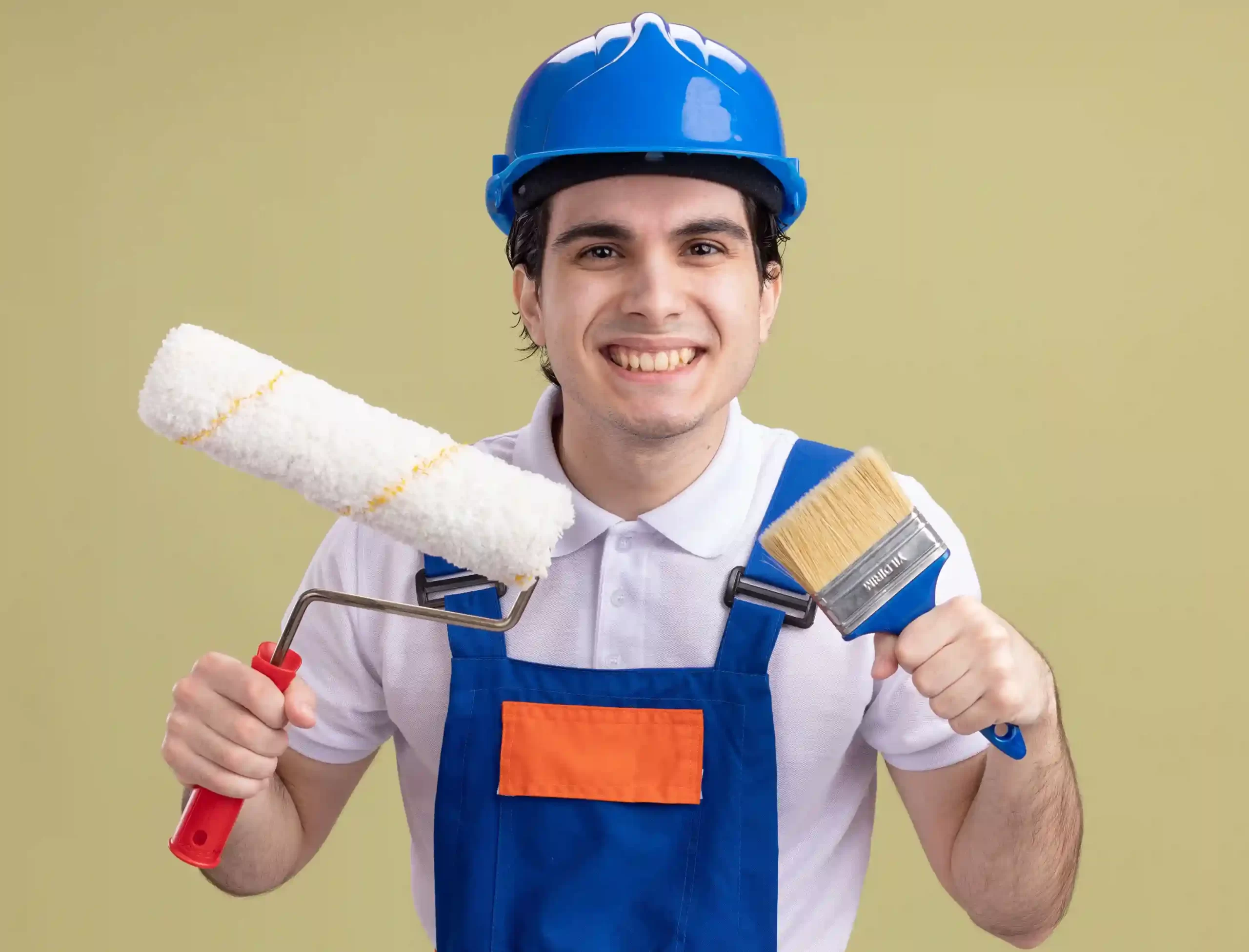 young-builder-man-construction-uniform-safety-helmet-holding-paint-roller-brush-looking-front-smiling-broadly-standing-green-wall (2)_11zon